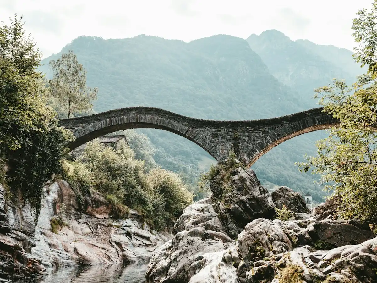 Arch gray concrete bridge — Verzasca, Ticino, Switzerland