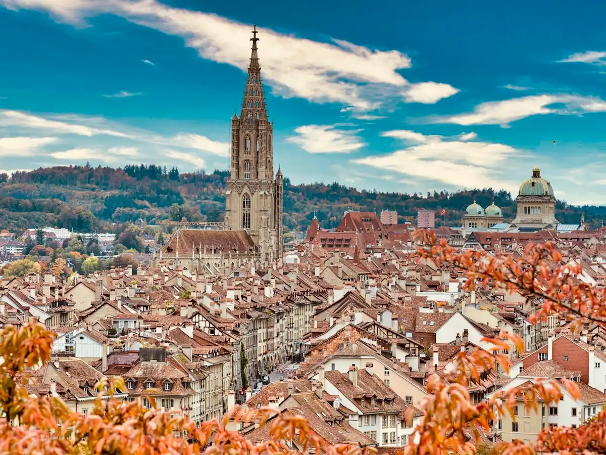 Brown and white concrete building under blue sky during daytime — Bern, Switzerland
