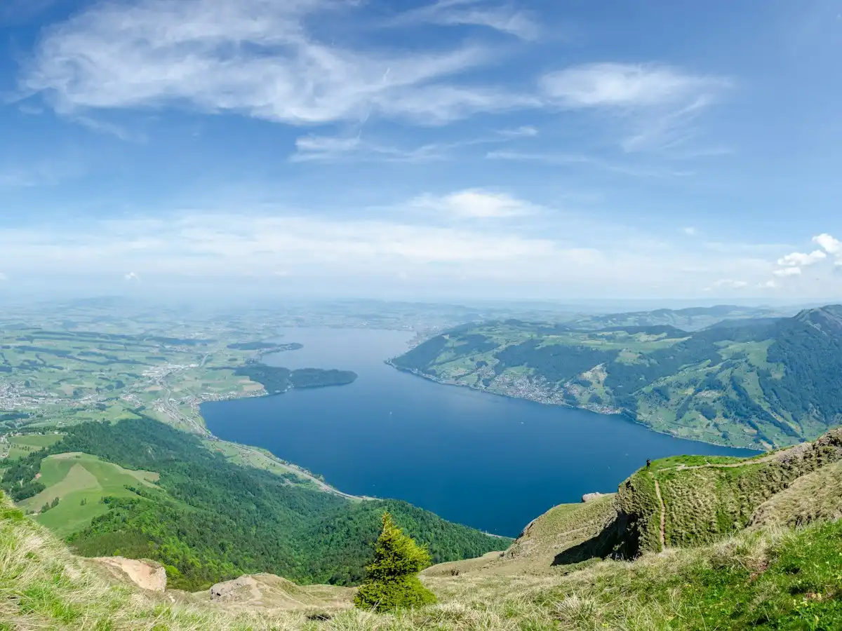 Aerial view of green mountains and blue sea under blue sky during daytime — Rigi, Lake Lucerne, Switzerland