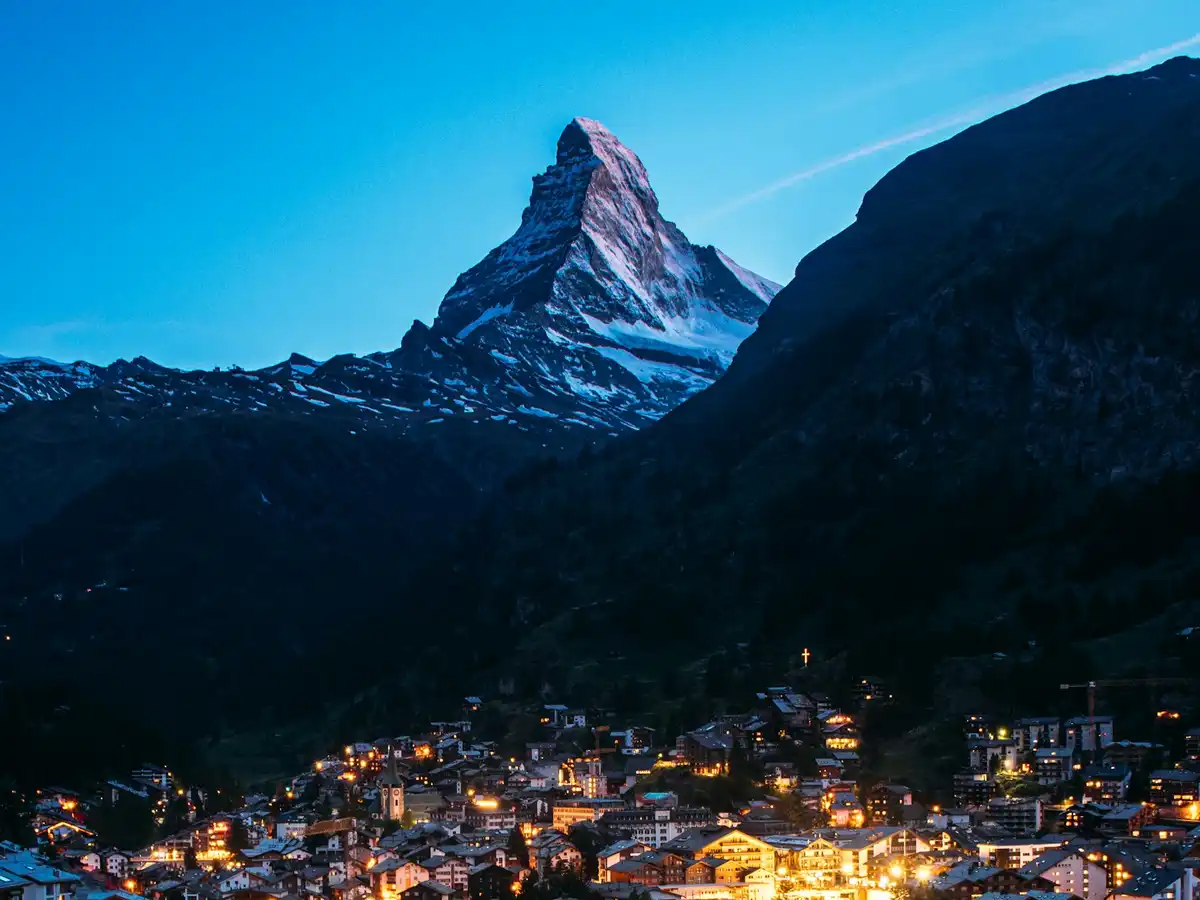 A view of a city with a mountain in the background — Zermatt, Switzerland
